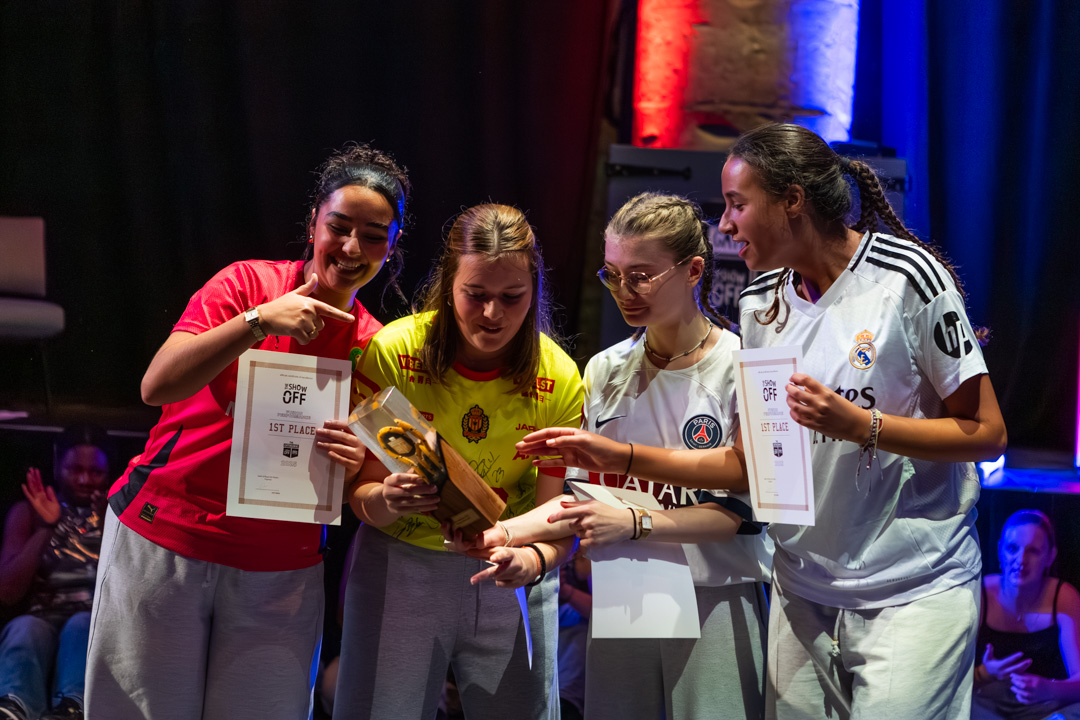 Show Off winners proudly holding their trophy and certificates
