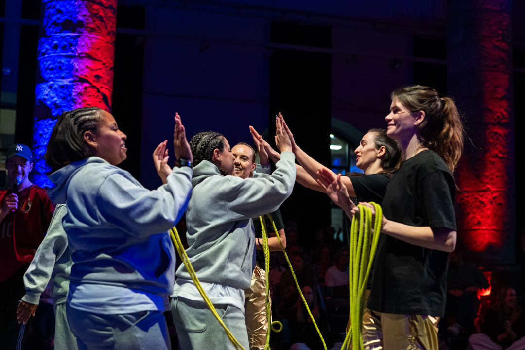 Two crews high-fiving after a battle round